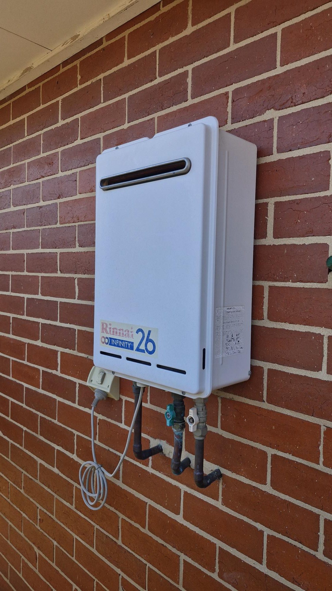 Gas hot water unit on an outside wall in Wangaratta