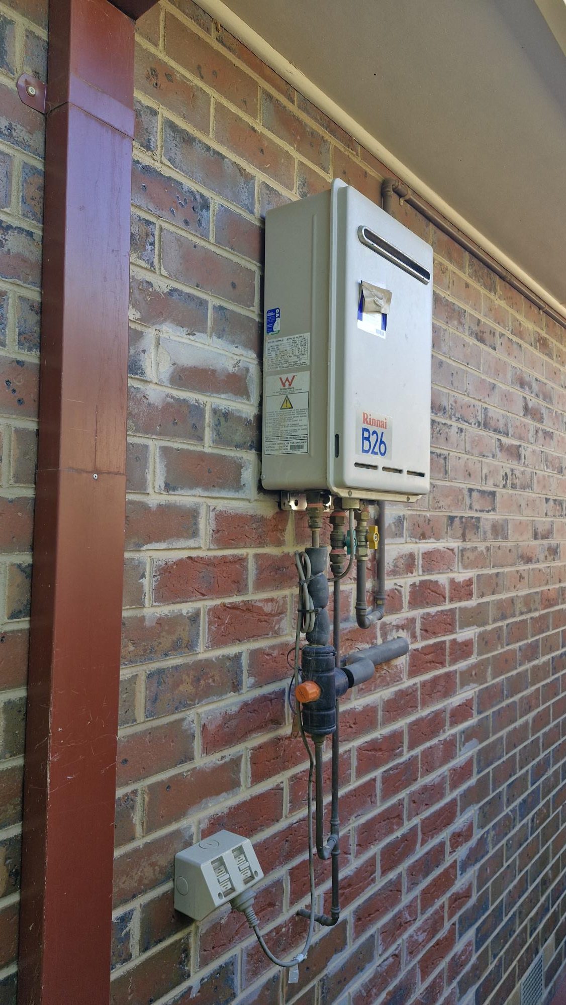 Gas hot water unit on an outside wall